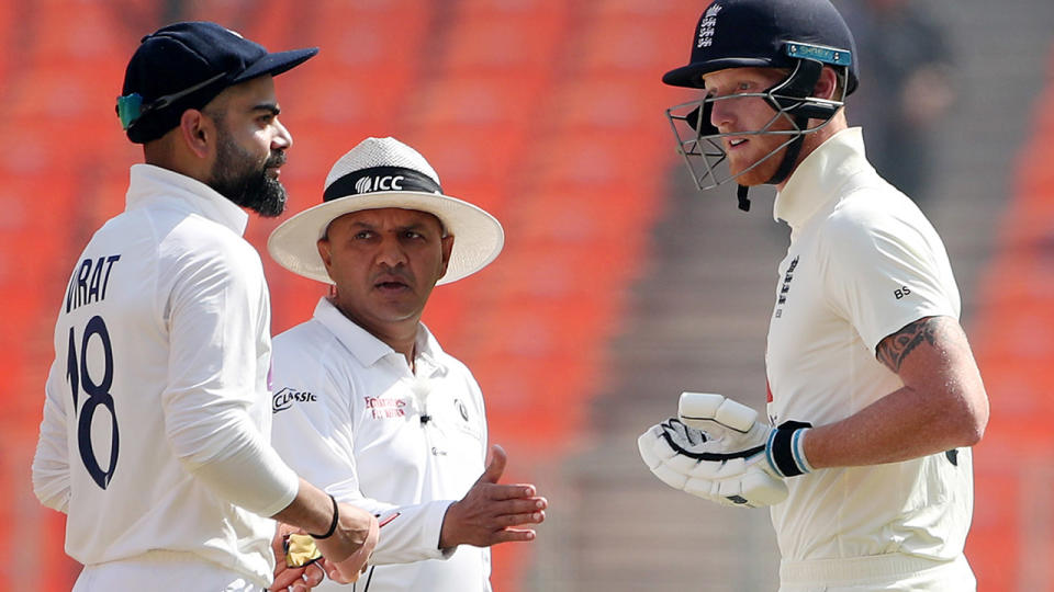 Virat Kohli and Ben Stokes, pictured here being separated by umpire Virender Sharma.