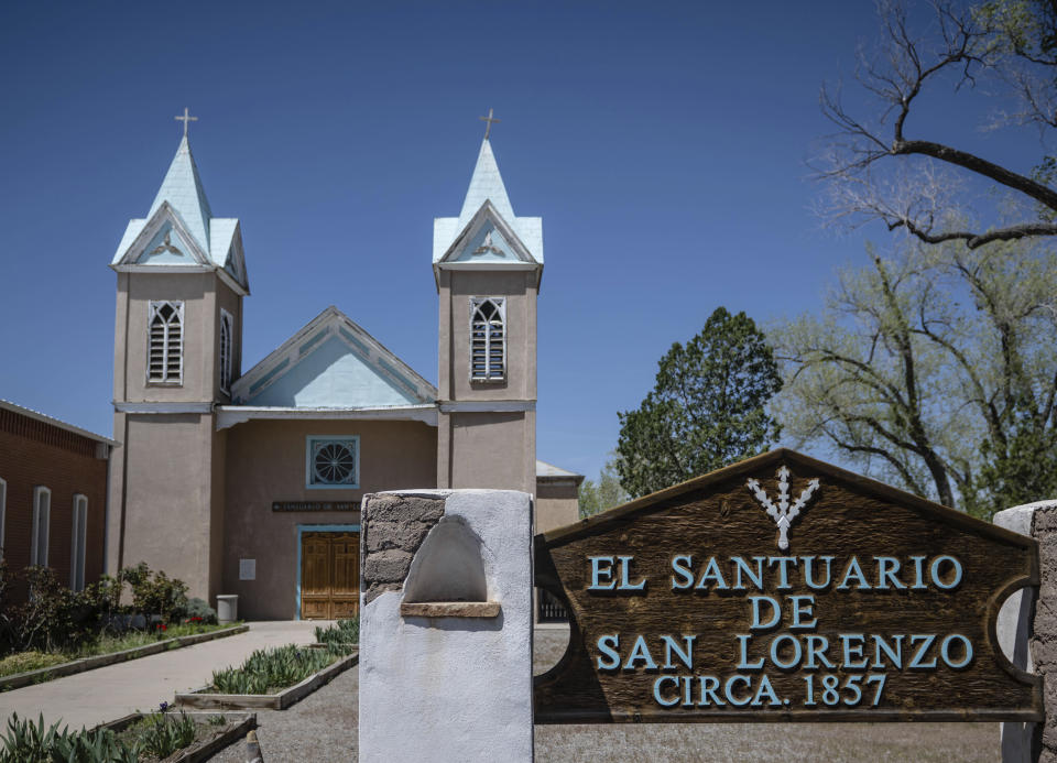 An exterior view of El Santuario de San Lorenzo in Bernalillo, New Mexico, Monday, April 17, 2023. The 'mayordomos' or caretakers of San Lorenzo – both the historic sanctuary of St. Lawrence and the image of the saint that one family hosts each year in its home – preserve New Mexican Spanish in their prayers and annual celebrations. (AP Photo/Roberto E. Rosales)