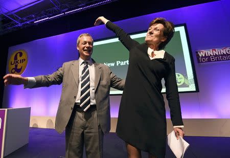 Nigel Farage (L), the outgoing leader of the United Kingdom Independence Party (UKIP), congratulates new leader Diane James, at the party's annual conference in Bournemouth, Britain, September 16, 2016. REUTERS/Toby Melville