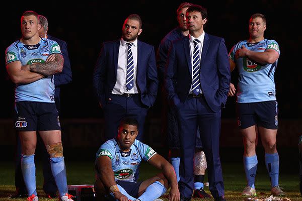 Laurie Daley and his dejected Blues troop after Game III. Image: Getty