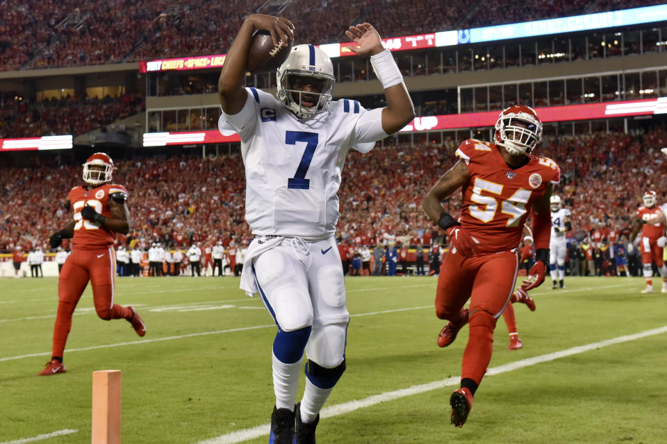 Indianapolis Colts quarterback Jacoby Brissett (7) scores a touchdown next to Kansas City Chiefs linebacker Damien Wilson (54) during the first half of an NFL football game in Kansas City, Mo., Sunday, Oct. 6, 2019. (AP Photo/Ed Zurga)