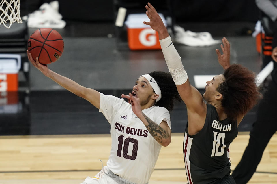 Arizona State's Jaelen House shoots around Washington State's Isaac Bonton during the second half of an NCAA college basketball game in the first round of the Pac-12 men's tournament Wednesday, March 10, 2021, in Las Vegas. (AP Photo/John Locher)