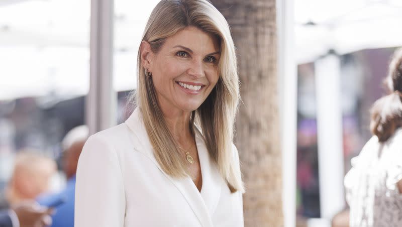 Lori Loughlin attends a ceremony honoring Holly Robinson Peete with a Star on the Hollywood Walk of Fame on Tuesday, June 21, 2022, in Los Angeles. Loughlin stars in “A Christmas Blessing,” her first Christmas movie since serving a two-month sentence for her role in the college admissions scandal.