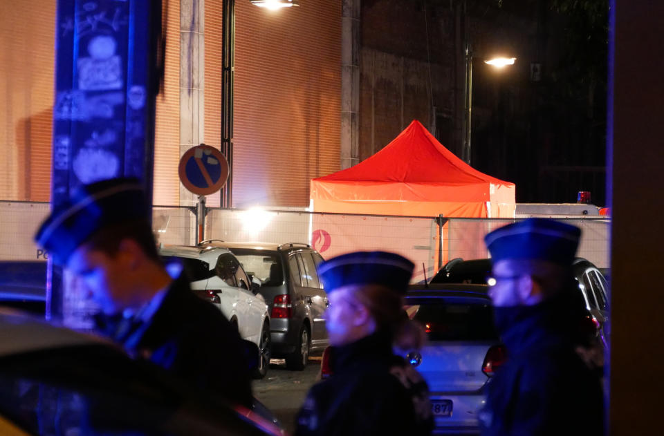 Police attend the scene of an incident in Brussels, Thursday Nov. 10, 2022. One police officer is dead and another injured in a stabbing attack in Brussels, which a Belgian judicial official says is suspected to be terrorism-linked. The suspected attacker was shot and “neutralized” after the stabbing Thursday evening, Belgian police said. (AP Photo/Sylvain Plazy)