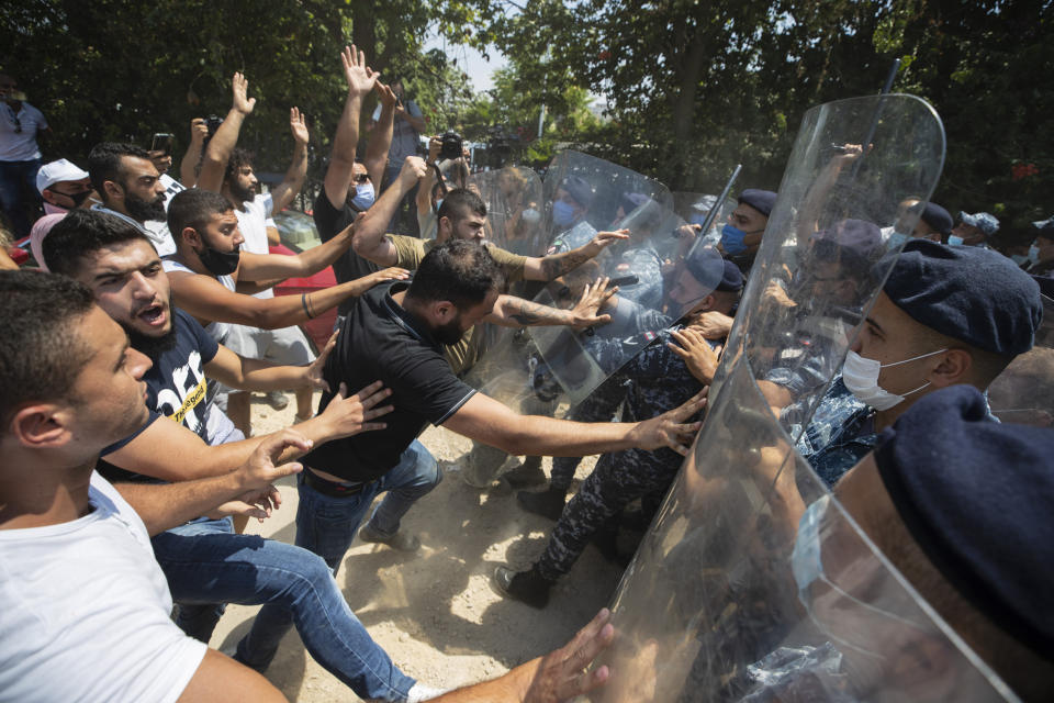 Image: Police scuffle with protesters in Beirut (Hassan Ammar / AP)