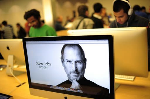 A photo of Apple's founder Steve Jobs is displayed at Apple's flagship store on New York's 5th Avenue. Apple founder and visionary Jobs has died from cancer aged just 56, a premature end for a man who revolutionized modern culture and changed forever the world's relationship to technology through inventions such as the iPad and iPhone