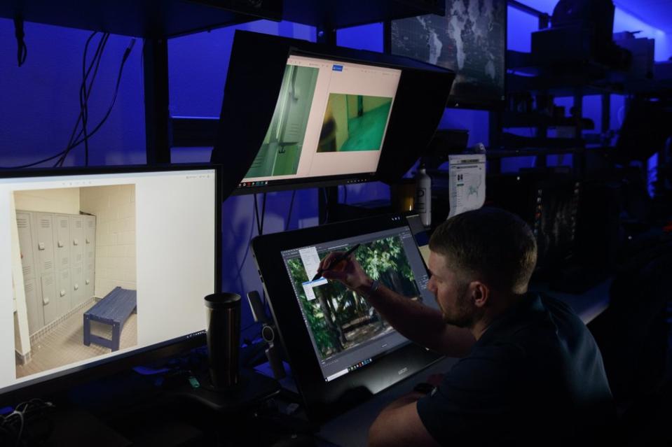 A computer forensic analyst reviews a case inside the Victim Identification Lab, part of Homeland Security's Child Exploitation Investigations Unit, in Fairfax, Va., Friday, Nov. 22, 2019. The Homeland Security Investigations section's little-known Child Exploitation Investigations lab is where agents scour disturbing photos and videos of child sexual abuse. They look for unlikely clues that help them identify the children and bring their abusers to justice. In one case, it was the loud, persistent chirping of a bird. Another time, it was unusual playground equipment. (AP Photo/Jacquelyn Martin)