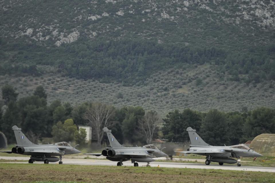 Rafale jets prepare to take off during a hand over ceremony in Tanagra military air base, about 82 kilometres (51miles) north of Athens, Greece, on Wednesday, Jan. 19, 2022. Six advanced-tech Rafale jets bought from the French air force were handed over Wednesday to the Greek armed forces ‒ the first major delivery to result from multi-billion euro defense deals sealed with Paris last year. (AP Photo/Thanassis Stavrakis)