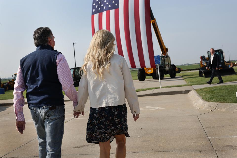 Republican presidential candidate North Dakota Governor Doug Burgum with his wife Kathryn Burgum arrive for a campaign stop at the Rueter's equipment dealership where he held a town hall meeting with employees on June 9, 2023 in Elkhart, Iowa. Burgum is making his first campaign swing through Iowa since announcing his candidacy earlier this week.