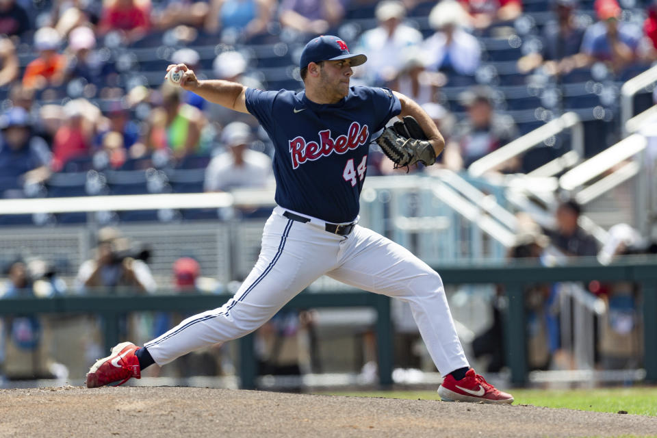 Mississippi staring pitcher Dylan DeLucia (44) throws a pitch in the first inning against Arkansas during an NCAA College World Series baseball game Thursday, June 23, 2022, in Omaha, Neb. (AP Photo/John Peterson)