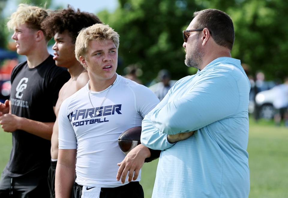 Isaac Wilson talks with his dad Mike Wilson during a 7-on-7 passing league game in Layton on Friday, June 9, 2023. | Scott G Winterton, Deseret News