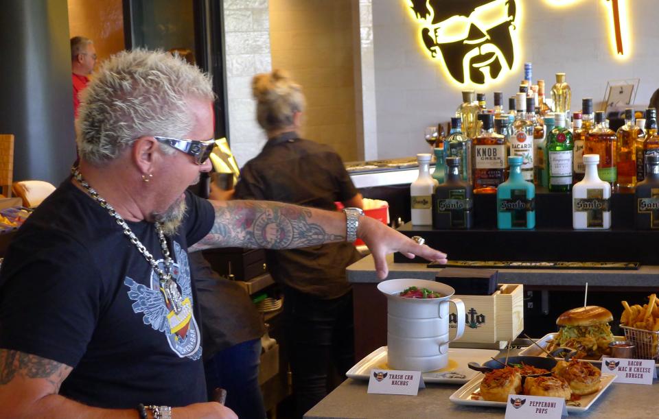 Guy Fieri explains how he makes Trash Can Nachos at Guy Fieri's Kitchen + Bar in Council Bluffs.