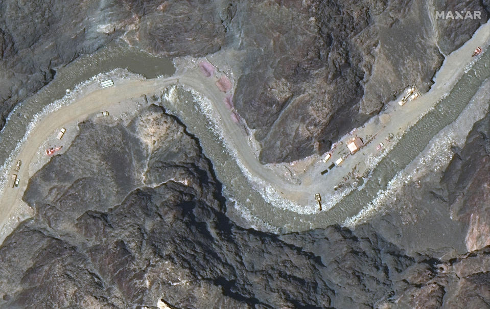 This June 22, 2020, satellite image provided by Maxar Technologies shows a road under construction near the Line of Actual Control, the border between India and China. Chinese and Indian military commanders agreed to disengage their forces in the disputed area of the Himalayas following a clash that left at least 20 soldiers dead, both countries said. The commanders reached the agreement Monday, June 22, 2020 in their first meeting since the June 15 confrontation, the countries said. (Maxar Technologies via AP)