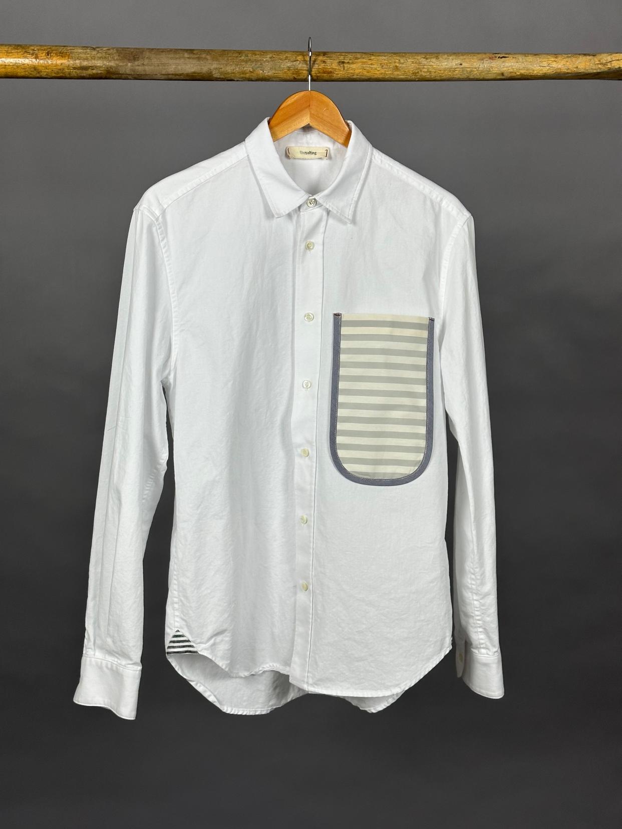 <p><a href="https://thesalting.com/collections/season-13-fall-2023/products/u-pocket-shirt-washed-oxford-salt-stripe" rel="nofollow noopener" target="_blank" data-ylk="slk:Shop Now;elm:context_link;itc:0;sec:content-canvas" class="link rapid-noclick-resp">Shop Now</a></p><p>U Pocket Shirt Washed Oxford Salt Stripe</p><p>thesalting.com</p><p>$295.00</p>