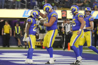 Los Angeles Rams running back Darrell Henderson Jr., left, celebrates with teammates after scoring a touchdown during the second half of an NFL football game against the Seattle Seahawks Sunday, Nov. 19, 2023, in Inglewood, Calif. (AP Photo/Mark J. Terrill)