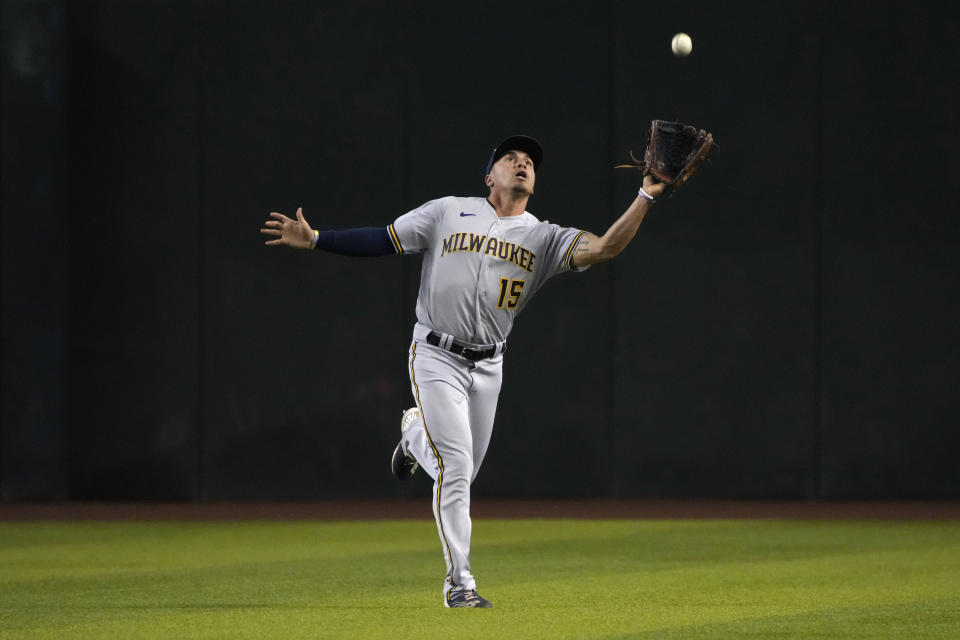 Milwaukee Brewers center fielder Tyrone Taylor makes a running catch for an out on a ball hit by Arizona Diamondbacks' Christian Walker in the first inning during a baseball game, Saturday, Sept. 3, 2022, in Phoenix. (AP Photo/Rick Scuteri)