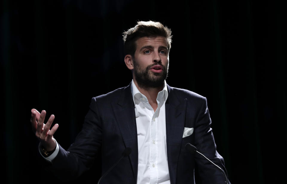 FC Barcelona soccer player and founder of investment group Kosmos, Gerard Pique delivers his speech during the presentation of the city of Madrid as hosts of the new Davis Cup for the next two years in Madrid, Spain, Wednesday, Oct. 17, 2018. (AP Photo/Manu Fernandez)