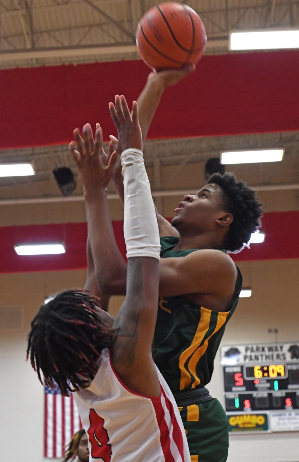 Captain Shreve's Jyrin Sowell goes up for two against Parkway's Michael Feast in a game last season.