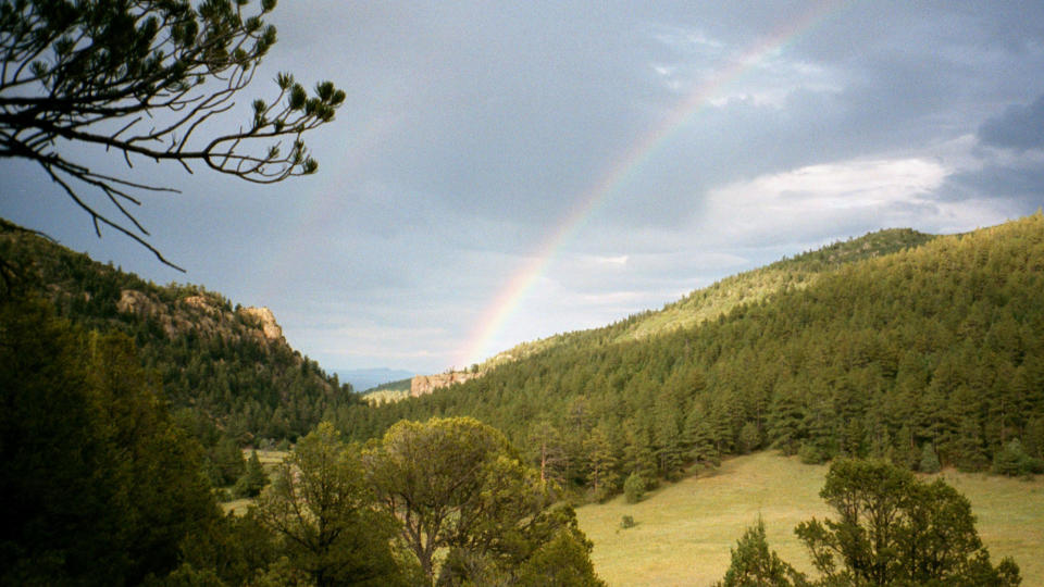 FILE - In this July 2001 file photo, a double rainbow is shown in the early evening in Philmont Scout Ranch, N.M. The vast Philmont Scout Ranch, one of the most spectacular properties owned by the financially struggling Boy Scouts of America, has been mortgaged by the BSA, according to member of Philmont’s oversight committee. (AP Photo/Ira Dreyfuss, File)