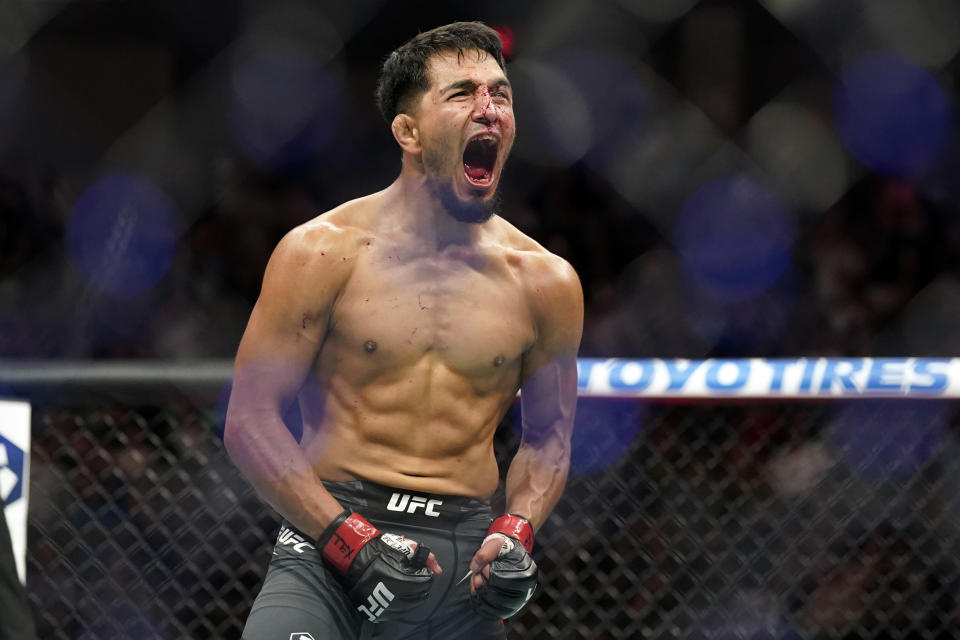 Jun 18, 2022; Austin, Texas, USA; Adrian Yanez (red gloves) reacts after his fight against Tony Kelley (blue gloves) during UFC Fight Night at Moody Center. Mandatory Credit: Scott Wachter-USA TODAY Sports