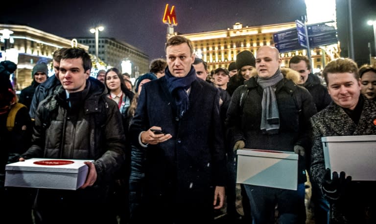 Supporters of Russian opposition leader Alexey Navalny (centre) carry boxes with signatures to nominate him as opposition candidate for the presidential election