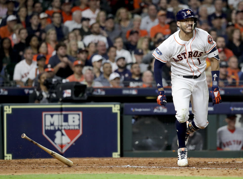 Houston Astros' Carlos Correa watches his double against the Boston Red Sox during the seventh inning in Game 4 of a baseball American League Championship Series on Wednesday, Oct. 17, 2018, in Houston. (AP Photo/David J. Phillip)