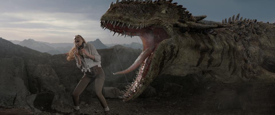 Actress Carol Cobb (Karen Gillan) shares a moment with a large dinosaur making "Cliff Beasts 6"in the new Netflix comedy "The Bubble."