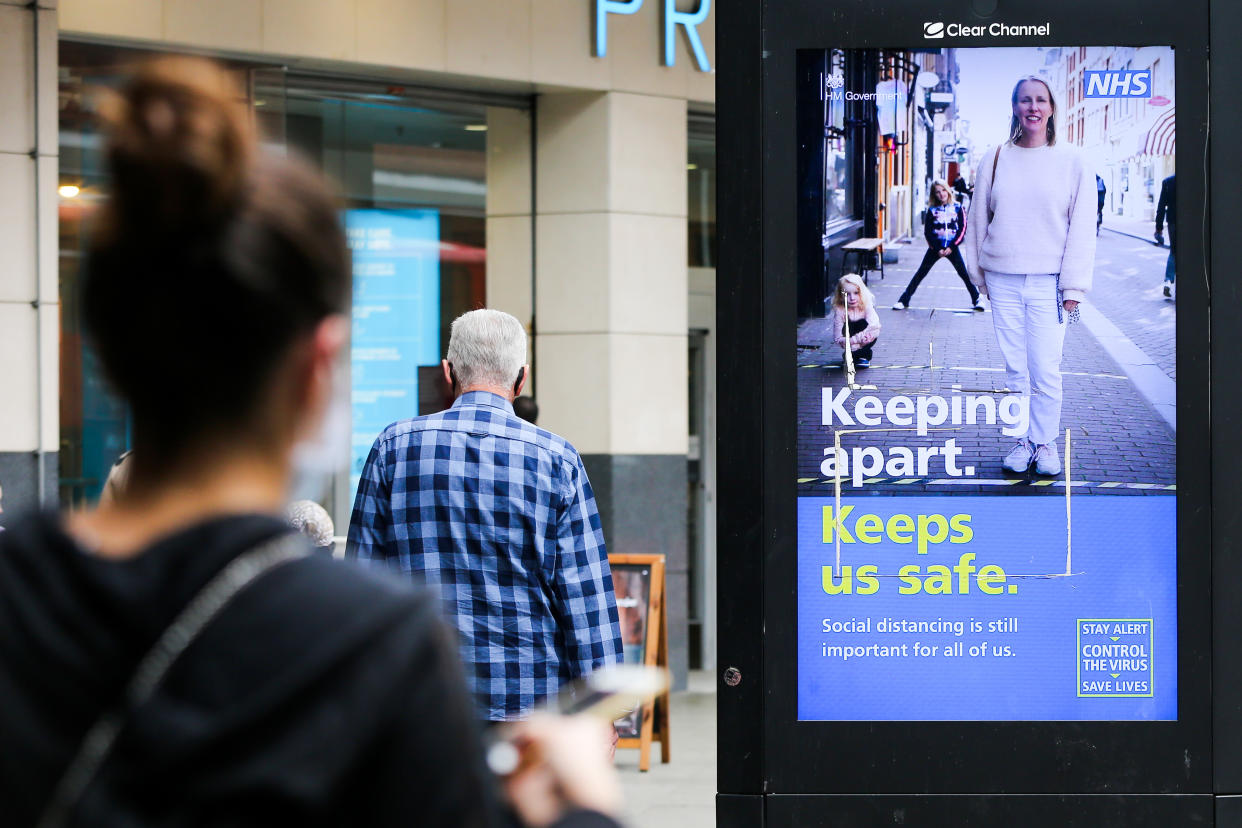 A woman looks at the UK government's digital advert in London which highlights 'Keeping apart, Keep safe' during the COVID19. The number of people who tested positive for the coronavirus is increasing. (Photo by Dinendra Haria / SOPA Images/Sipa USA)