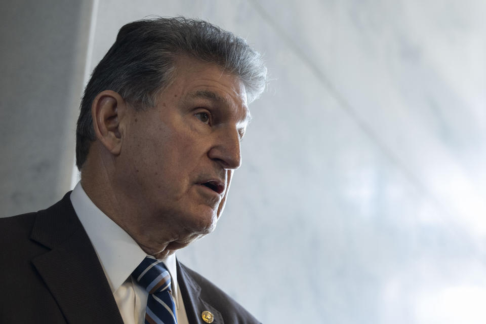 Sen. Joe Manchin, D-W.Va., speaks to reporters outside his office on Capitol Hill.