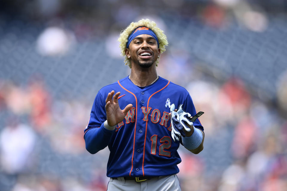 New York Mets shortstop Francisco Lindor talks on the field during the middle of the third inning of a baseball game against the Washington Nationals, Sunday, June 20, 2021, in Washington. (AP Photo/Nick Wass)