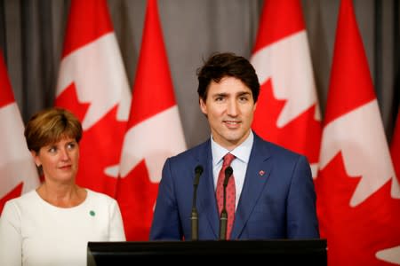 FILE PHOTO: Canada's Prime Minister Justin Trudeau and Canada's Minister for International Development Marie-Claude Bibeau attend a news conference at Canada's Embassy in London