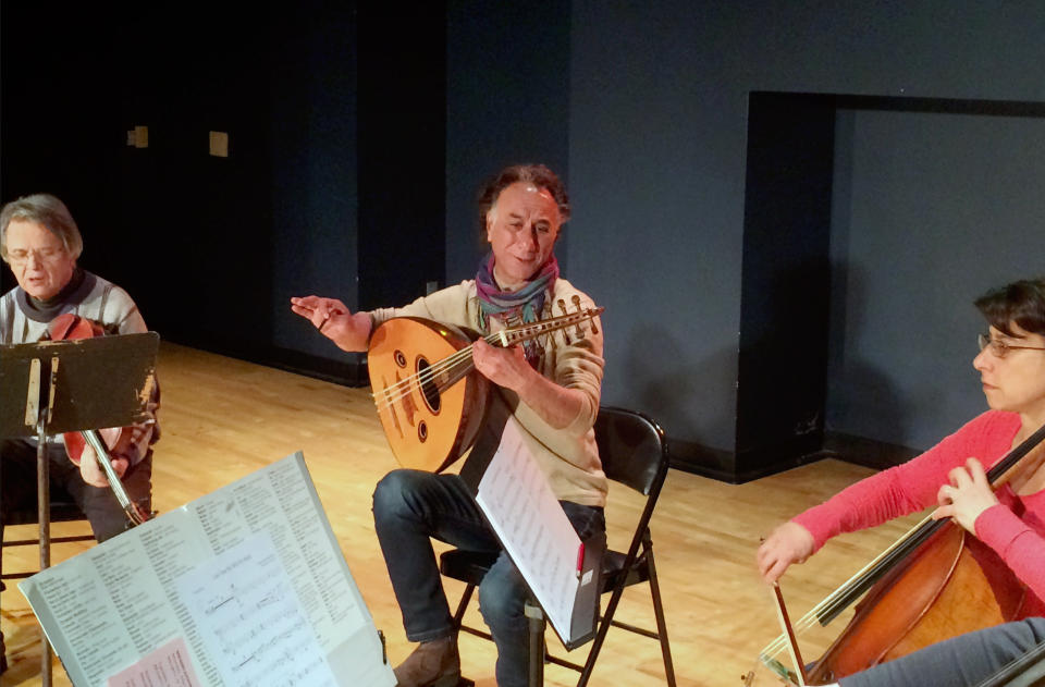 Iraqi American composer and musician Rahim AlHaj, center, rehearses in Dearborn, Mich., Thursday, March 23, 2017. He composed a series of pieces based on the letters of eight Iraqis sharing personal tales during wartime. (AP photo/Jeff Karoub)