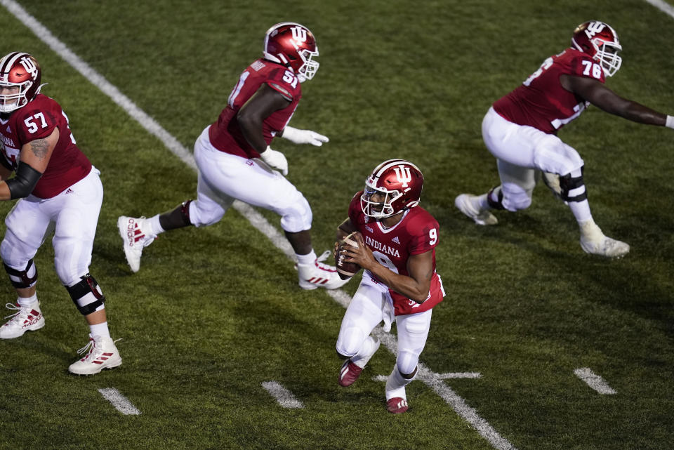 Indiana quarterback Michael Penix Jr. (9) runs in for a two-point conversion during overtime of an NCAA college football game against Penn State, Saturday, Oct. 24, 2020, in Bloomington, Ind. Indiana won 36-35 in overtime. (AP Photo/Darron Cummings)