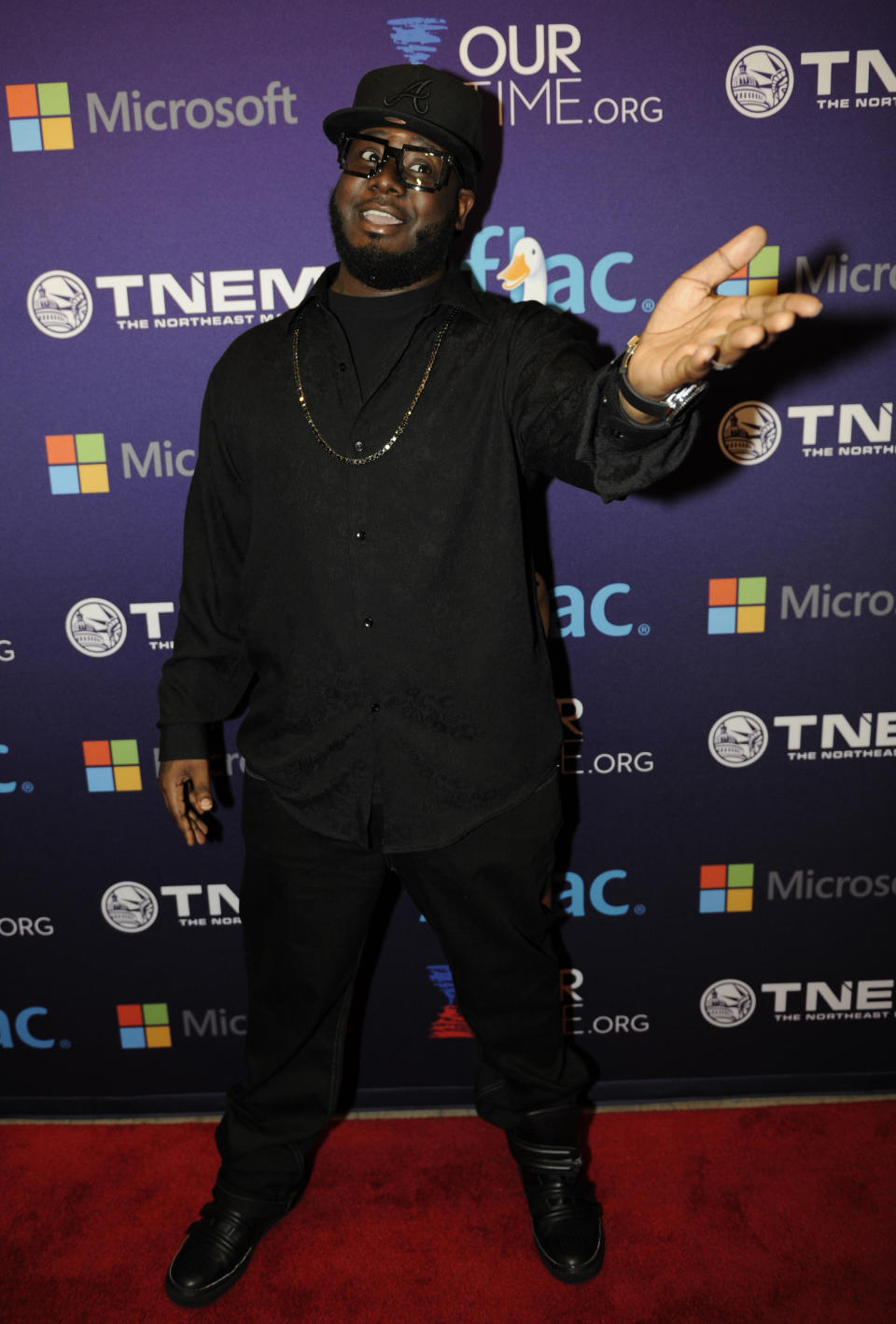 T-Pain arrives at the OurTime.org Inaugural Youth Ball Generation Now Party on Saturday, Jan. 19, 2013, in Washington. (Photo by Nick Wass/Invision/AP)