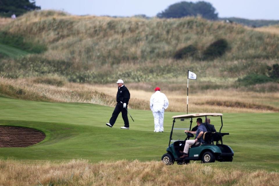 In this Saturday, July 14, 2018, file photo, U.S. President Donald Trump walks off the 4th green while playing at Turnberry golf club, in Turnberry, Scotland. (AP Photo/Peter Morrison, File)