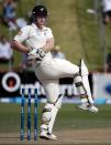 New Zealand's James Neesham misses a shot against India during the second innings on day four of the second international test cricket match at the Basin Reserve in Wellington, February 17, 2014.