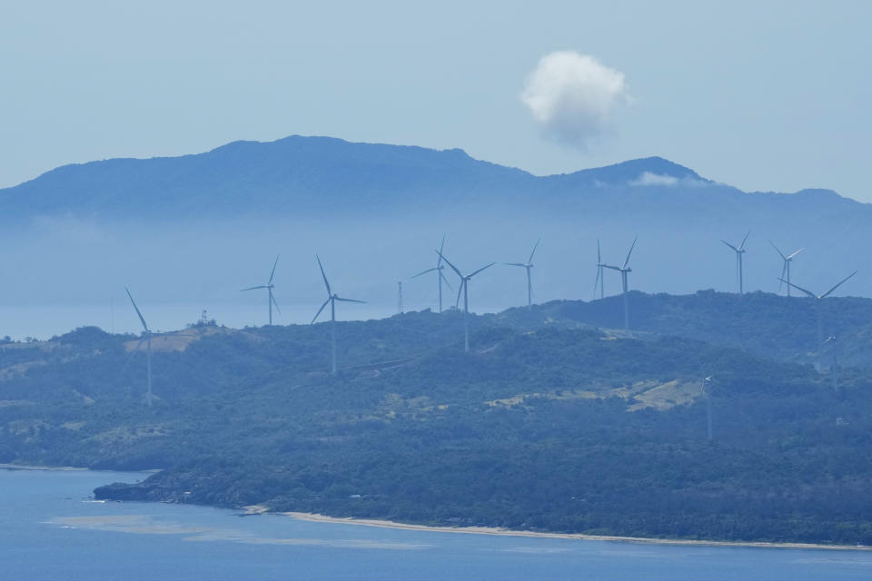 Windmills are seen at Ilocos Norte province, northern Philippines on Monday, May 6, 2024. Ilocos Norte province is home to most of the wind farms in the country. (AP Photo/Aaron Favila)