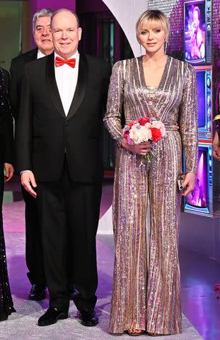 <p>Stephane Cardinale - Corbis/Corbis via Getty</p> Prince Albert and Princess Charlene at the "Bal de la Rose" (Rose Ball) in Monaco on March 23, 2024.