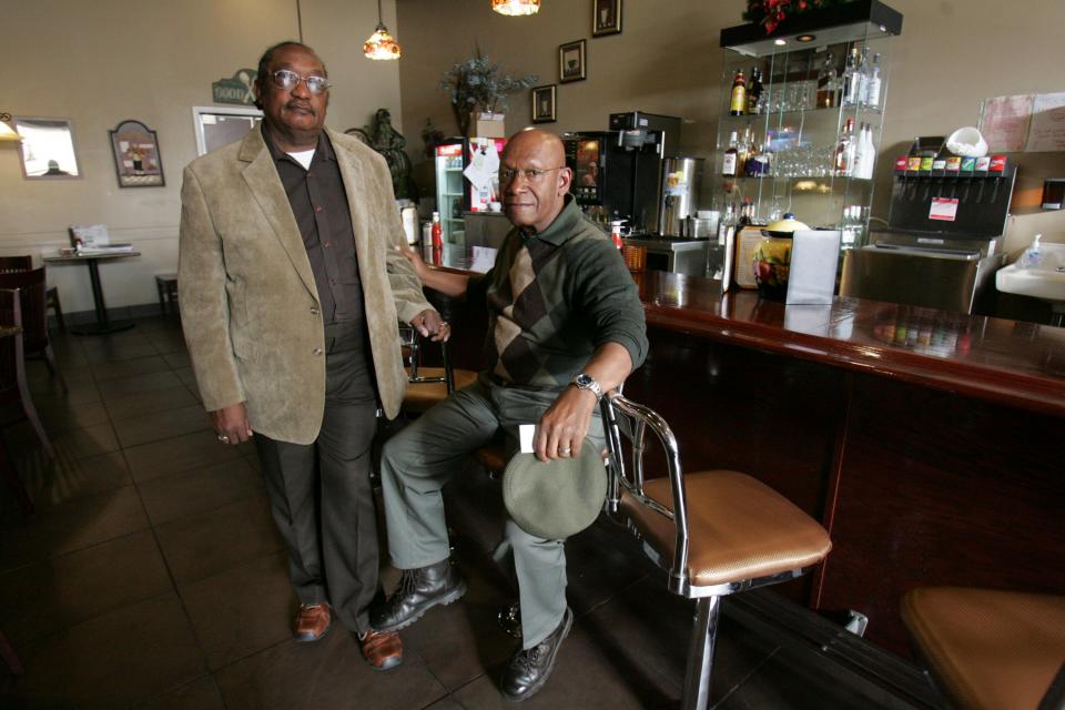 In this March 5, 2009, file photo, the Rev. W. T. "Dub" Massey, right, and Willie McLeod, left, pose at the counter where they were among the "Friendship Nine" who were jailed during 1960s civil rights sit-ins.