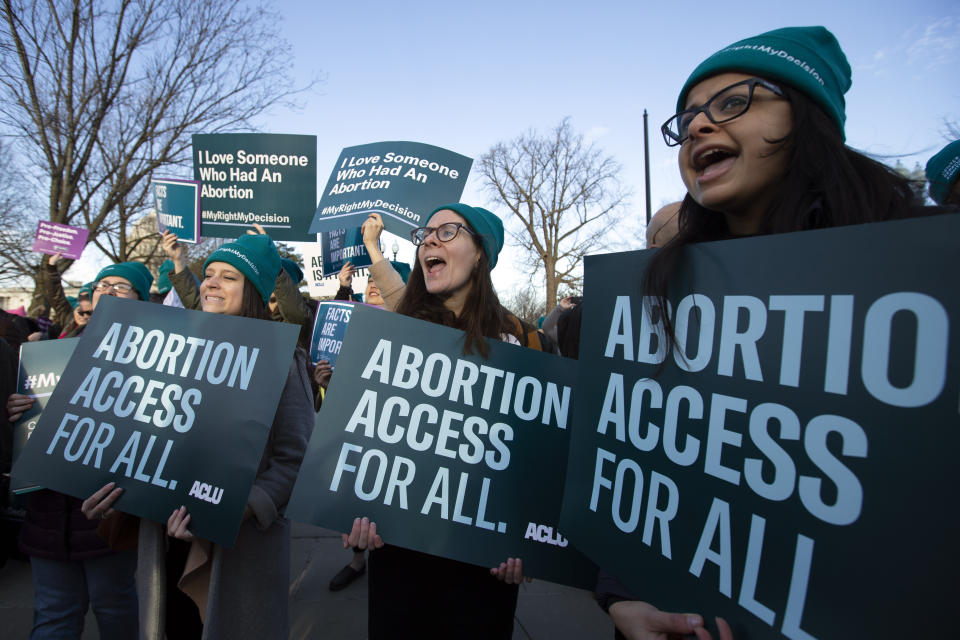 Abortion rights demonstrators rally outside of the U.S. Supreme Court in Washington, Wednesday, March 4, 2020. The Supreme Court is taking up the first major abortion case of the Trump era Wednesday, an election-year look at a Louisiana dispute that could reveal how willing the more conservative court is to roll back abortion rights. (AP Photo/Jose Luis Magana)