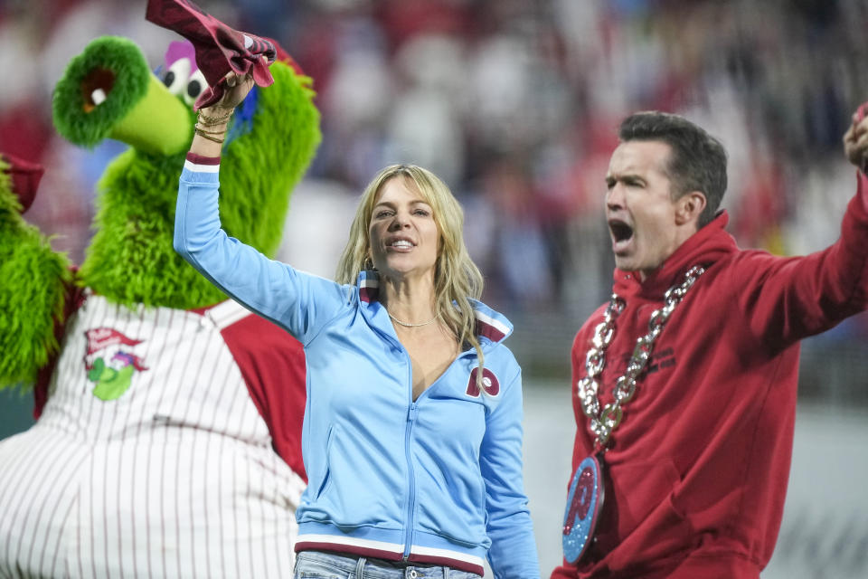 The cast of It's Always Sunny in Philadelphia cheer on the crowd during the fifth inning in Game 2 of the baseball NL Championship Series between the Philadelphia Phillies and the Arizona Diamondbacks in Philadelphia, Tuesday, Oct. 17, 2023. (AP Photo/Brynn Anderson)