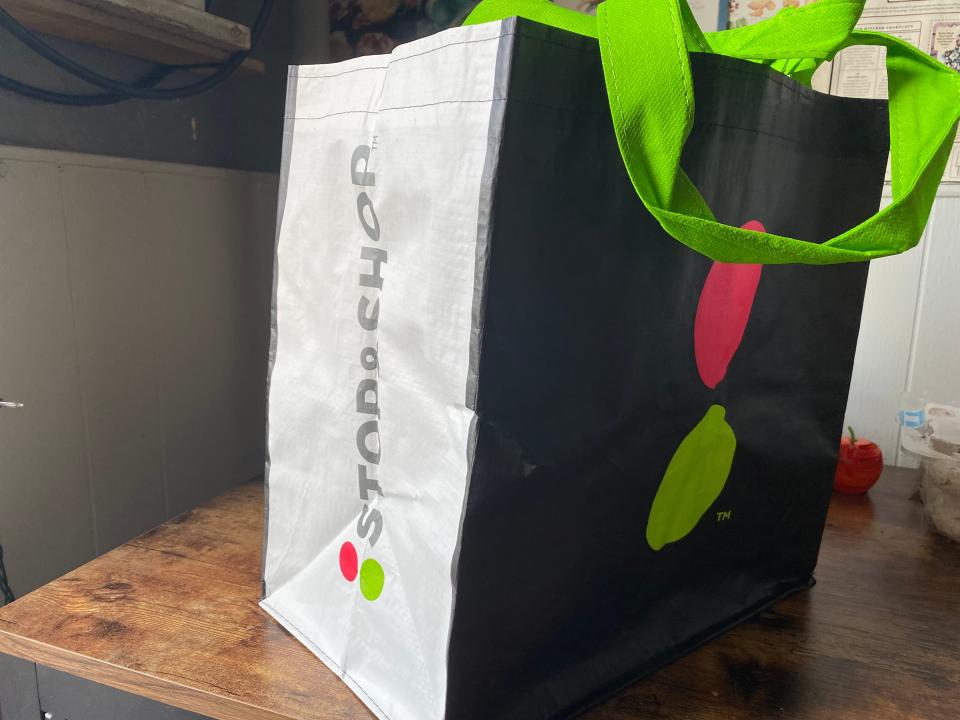 A shop and stop reusable bag sitting on a table