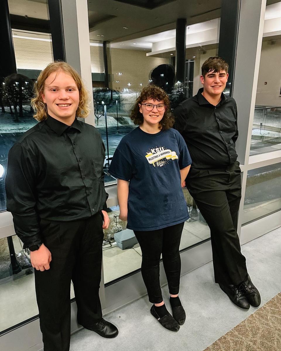 West Branch freshmen trombone players Luke Dyke, left, and Gavin Clay, right, are seen with West Branch alumnus Emilee Sanor, a Kent State graduate student, at the Kent State All Star Band event on Jan. 14, 2023.