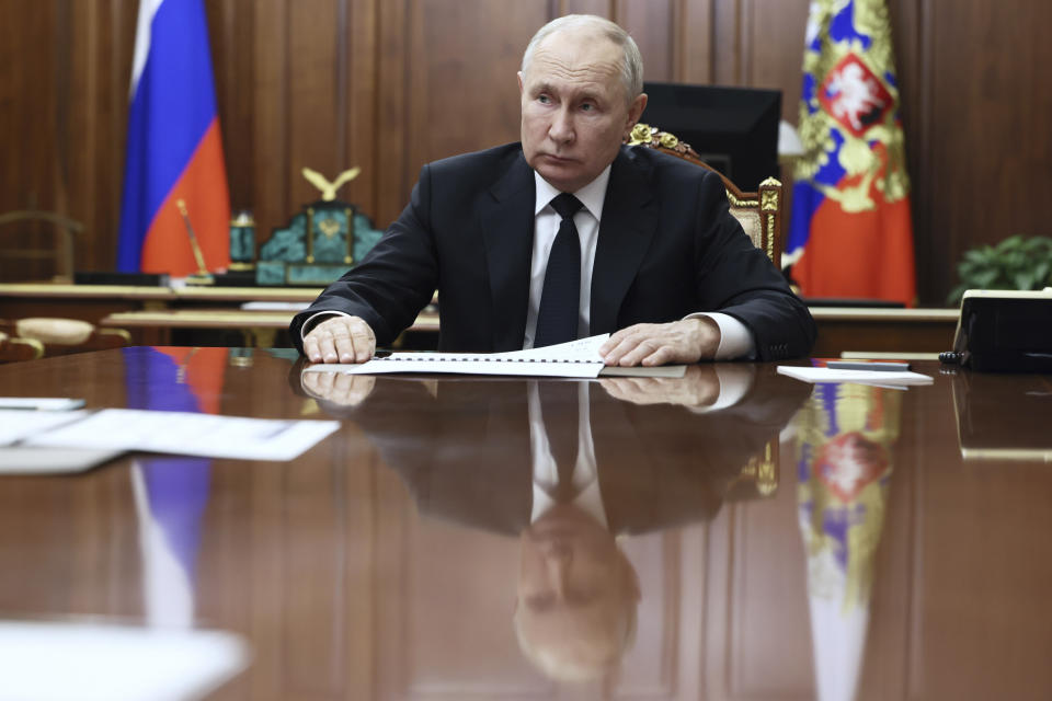 FILE - Russian President Vladimir Putin listens to Russian Deputy Prime Minister - Minister of Industry and Trade Denis Manturov during a meeting at the Kremlin, in Moscow, Russia, Tuesday, Oct. 24, 2023. Putin declared earlier this month that Moscow could play the role of mediator to help end the Israel-Hamas war, thanks to its friendly ties with both Israel and the Palestinians, adding that "no one could suspect us of playing up to one party." (Gavriil Grigorov, Sputnik, Kremlin Pool Photo via AP, File)