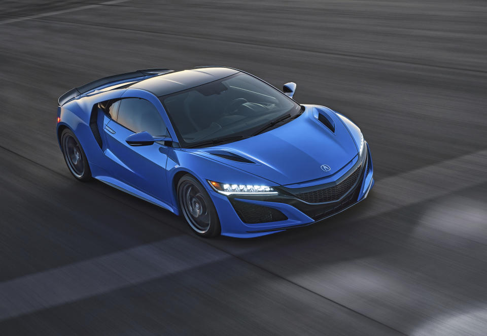 This photo provided by Acura shows the 2021 Acura NSX, an exotic sports car with a hybrid powertrain and sharp handling. (Jeff Ludes/American Honda Motor Co. via AP)