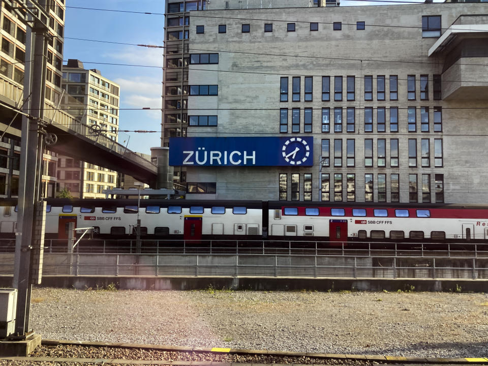 A train waits to leave at the main train station in Zurich, Saturday, May 21, 2022. The World Economic Forum is encouraging European attendees to come to its exclusive gathering in the Swiss Alps by train. Its part of efforts to burnish the sustainability credentials for an event in Davos that conjures up up images of government leaders, billionaire elites and corporate titans jetting in on carbon-spewing private planes. (AP Photo/Kelvin Chan)