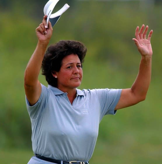 07/05/2002 - SUBJECT: NANCY LOPEZ; SUBJECT: U.S. WOMEN'S OPEN - HUTCHISON, KANSAS - JULY 5, 2002: Nancy Lopez of USA waves to fans as she makes her way to the 18th green in what may be her last US Open during the second round of the U.S. Women's Open on July 5, 2002 at Prairie Dunes Country Club in Hutchison, Kansas. KEYWORDS: GAME. GOLF. (Photo By Harry How/Getty Images)