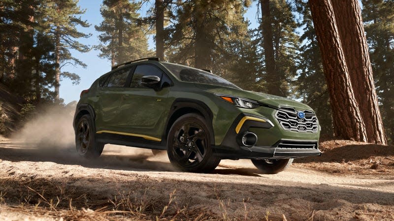 A green 2024 Subaru Crosstrek Sport.