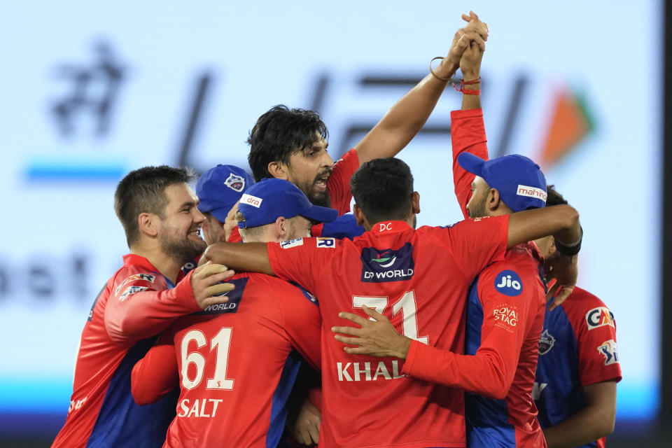 Delhi Capitals' Ishant Sharma, center, celebrates with teammate after their win in the Indian Premier League cricket match against Gujarat Titans in Ahmedabad, India, Tuesday, May 2, 2023. (AP Photo/Ajit Solanki)