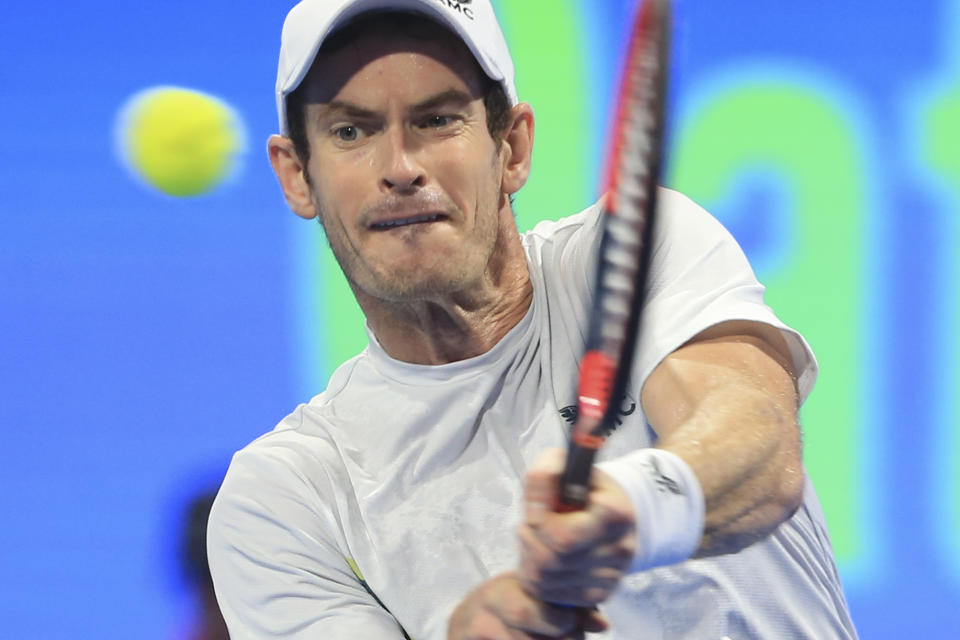 Andy Murray of Great Britain returns to Daniel Medvedev of Russia during Qatar Open tennis final in Doha, Qatar, Saturday, Feb. 25, 2023. (AP Photo/Hussein Sayed)